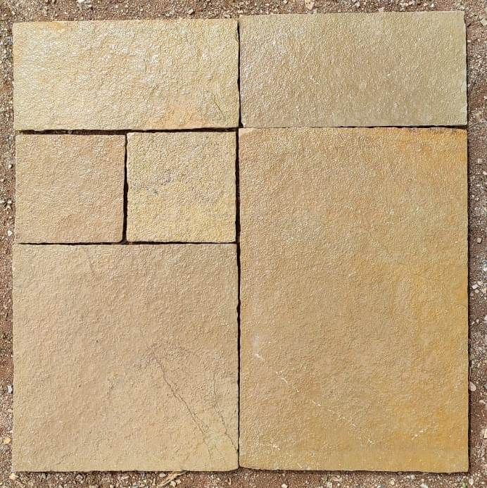 Kota Yellow paving slabs on ground wet