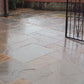 Autumn Brown sandstone paving slabs on driveway