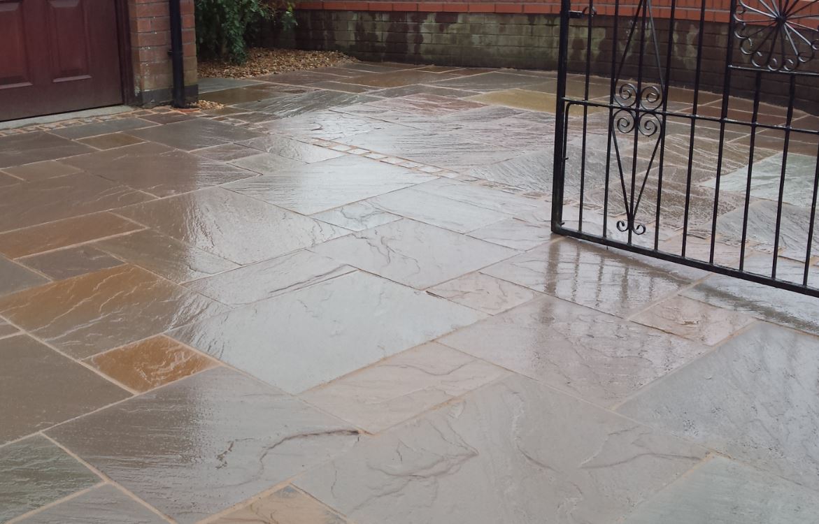 Autumn Brown sandstone paving slabs on driveway