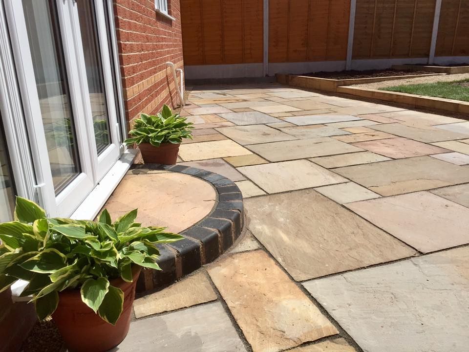 Rippon Buff sandstone paving slabs on patio