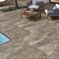 Rough Bruno porcelain paving slabs by swimming pool