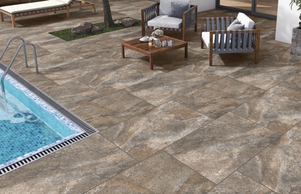 Rough Bruno porcelain paving slabs by swimming pool