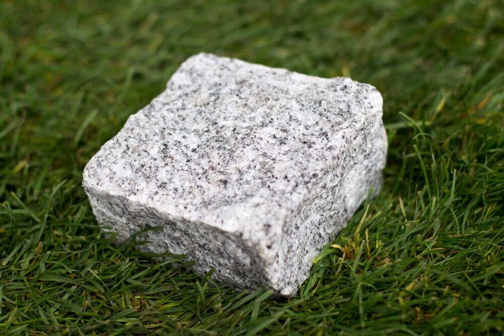 Silver Grey granite cobble on grass