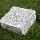 Silver Grey granite cobble on grass