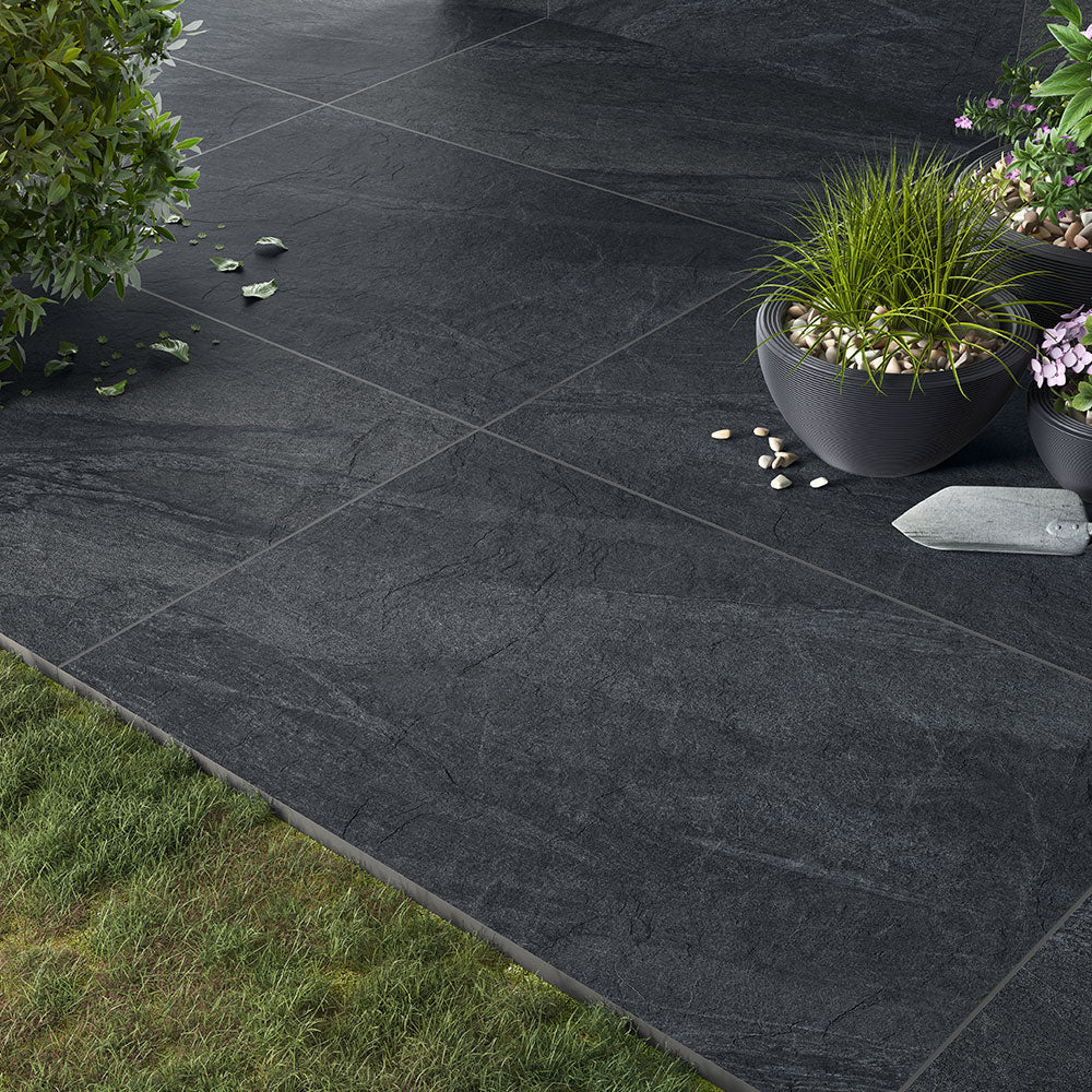 County Anthracite porcelain paving slabs on patio with plants