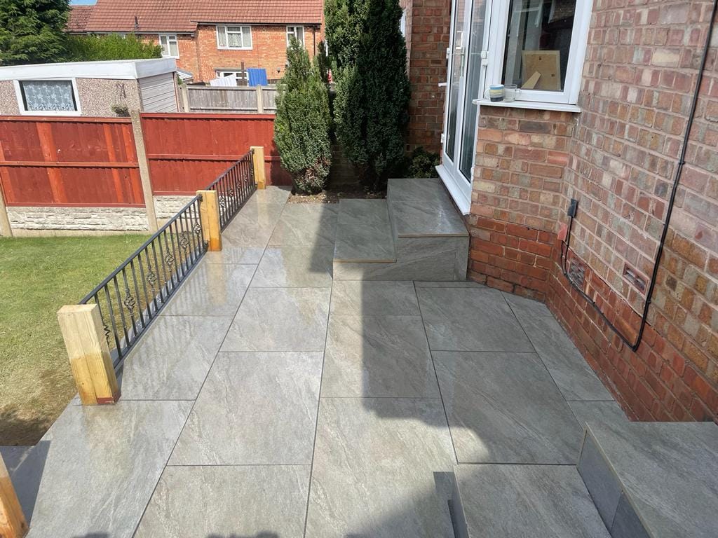 County Gris porcelain paving slabs on patio with steps