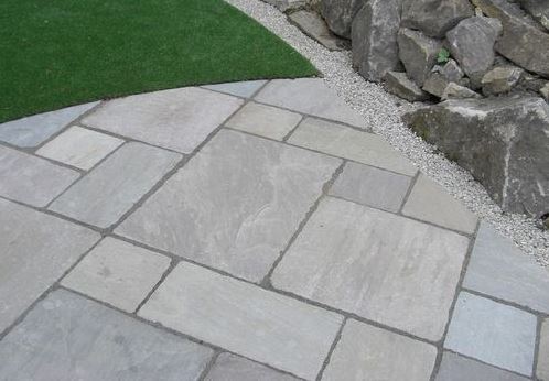 Kandla Grey sandstone paving slabs in mixed sizes by rocks