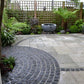 Galaxy Black granite cobbles in circle pattern on patio