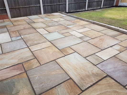 Rippon Buff sandstone paving slabs in Opus Romano laying pattern